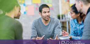 Nonprofit board members and staff engaged in a collaborative discussion about public charity governance and IRS public support requirements.